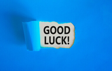 Poster - Good luck symbol. Concept words Good luck on beautiful white paper. Beautiful blue table blue background. Business, motivational good luck concept. Copy space.