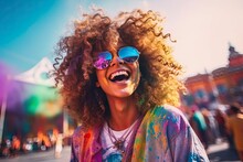 Portrait Of Smiling Young Woman Wearing Sunglasses Covered With Holi Color