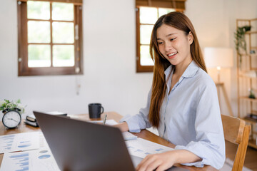 Wall Mural - Asian woman working from home, Remote work.