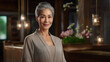 © zakiroff - Attractive, well maintained 60-year-old asian woman in a beige silk dressing gown, exuding elegance and vitality