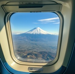 Wall Mural - a view of a mount fuji mountain is seen through the window of an airplane