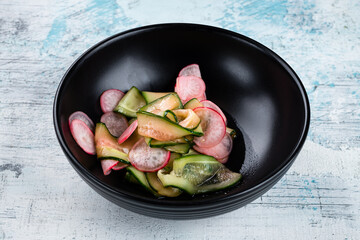 Wall Mural - Sunomono salad with cucumber, radish, rice vinegar and sesame oil.