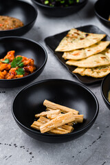 Canvas Print - Fuju asparagus marinated in rice vinegar, spicy chicken fillet with chili and Naan flatbread with cilantro.