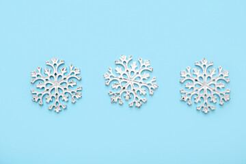 Wall Mural - Christmas decorative snowflakes on blue background