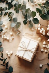 Wall Mural - Gift box wrapped in kraft paper and decorated with eucalypt leaves. DIY gift wrapping. Zero waste, plastic free, eco friendly concept. Holidays present