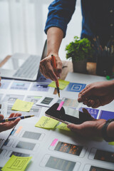Creative business team in mobile software design project, brainstorming meeting, working together, internet technology in smartphone web part, teamwork concept, colleagues.
