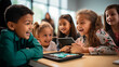 © Jammy Jean - Group of elementary school kids learning using digital tablets in class.