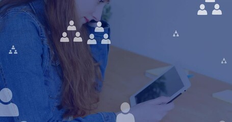 Wall Mural - animation of network of connections with icons over caucasian woman using tablet