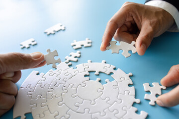  Hand put the last piece of jigsaw puzzle to complete the mission, Business solutions, success and strategy concept, The solution includes completing the mission.