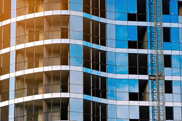 Poster - Glass curtain wall installation. Install of double-glazed windows in multi-storey building at construction site. Facade glazing, glazed façade.