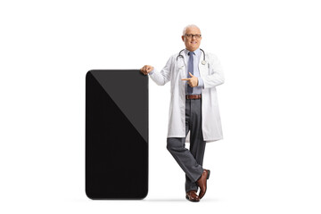 Wall Mural - Male doctor leaning on a smartphone and pointing