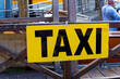 Close-up of yellow sign at water taxi stand at Grand Canal at City of Venice on a sunny summer day. Photo taken August 6th, 2023, Venice, Italy.