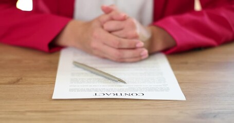 Wall Mural - Female hand contract document pen closeup. Negotiations on the draft deal and conclusion of a business contract