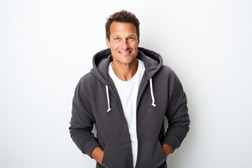 Portrait of a blissful man in his 40s wearing a zip-up fleece hoodie against a white background. AI Generation