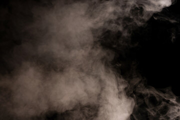 Wall Mural - White steam on a black background.