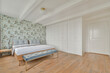 © ADDICTIVE STOCK - Elegant bedroom with floral wallpaper and modern furniture