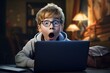 Shocked kid looking at laptop