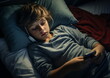 © atdigit - A Boy Using His Smartphone in Bed