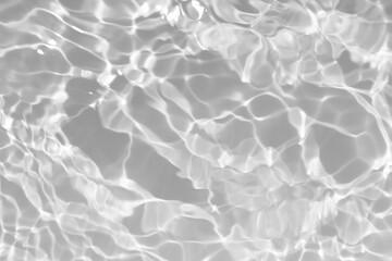 Sticker - White water with ripples on the surface. Defocus blurred transparent white colored clear calm water surface texture with splashes and bubbles. Water waves with shining pattern texture background.