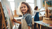 Little Beautiful Girl Draws On An Easel In An Art Studio, Drawing School, Child, Childhood, Creativity, Kid, Smiling Face, Portrait, Brush, Paints, Still Life, Picture, Interior, Student, Master Class