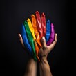hands with rainbow colored colors . Zero Discrimination Day
