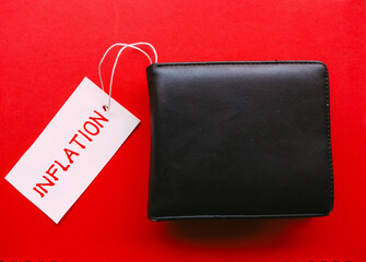 Wallet with INFLATION word on label tag for concept of inflation, rising prices and economic crisis.