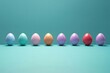 A row of colorful easter eggs isolated on blue background. Lined up colorful easter eggs
