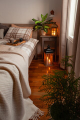 Wall Mural - cozy scandinavian bedroom interior in natural tones, blanket candles houseplants