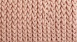 Light pink woolen knitted fabric texture.