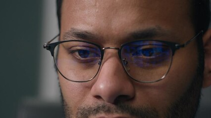 Man in eyeglasses in front of laptop coding data finance bitcoin crypto currency service business code cyber security program businessman in eyeglasses coder programmer reflection of computer screen
