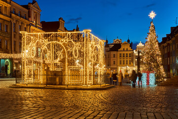 Wall Mural - Christmas decorations in the evening at the Old Market Square in Poznan