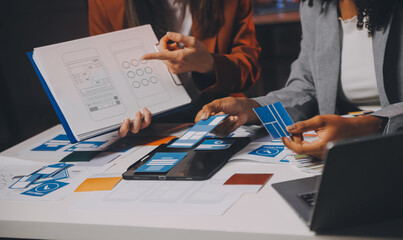 team of UI UX web designer are working together to develop mobile responsive websites. Mobile Mockup
