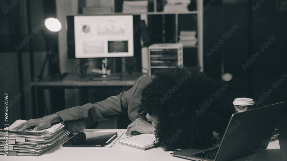 Overwork Depression Asian woman overwork and sleep on the table after she feeling very try ...