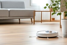 Robotic Vacuum Cleaner Cleaning A Wooden Floor In Modern Light Living Room.