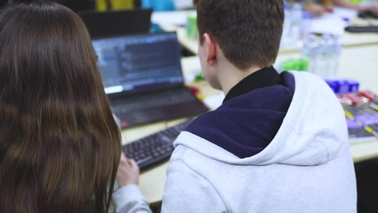 Software developer students in auditorium hall working on computer and laptop, programming contest hackathon competition, pc with coding program app, competitive programming for software engineer
