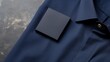 A blue shirt with a black square label.