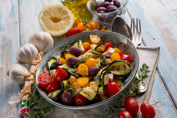 Canvas Print - chicken salad with zucchinis cherry tomatoes black olives and lemon