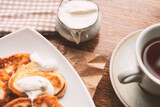 Fototapeta Mapy - Sweet homemade pancakes and tea cup, flat lay, top view