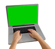 Woman using laptop with green screen