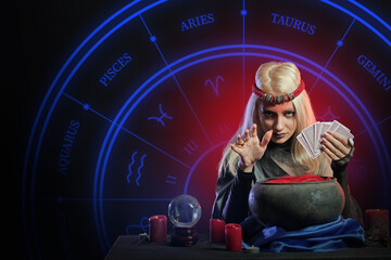 Wall Mural - Fortune teller with cards, crystal ball and cauldron on dark background