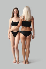 Poster - Body positive women in underwear on light background