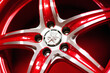 new alloy car wheel closeup, red color