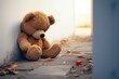Sorrowful scene Teddy bear sits against house wall, childs loneliness