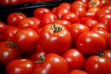 Fototapeta Dmuchawce - Vibrant tomatoes neatly arranged in a store drawer, marketfresh goodness