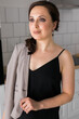 © satura_ - Portrait of a female online store business owner looking away and smiling. Woman doing her small business from home.