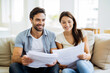 © Nedrofly - Couple Reviewing Important Document. Tax