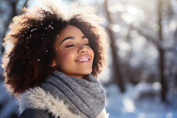 Wall Mural - A African woman breathes calmly looking up enjoying winter season