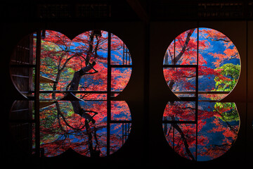 Wall Mural - Japanese autumn scenery in round windows with reflection