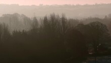 Aerial Drone Shot With Long Lens Of Winter Trees On Misty Morning At Sunrise 7x Lens
