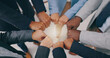© Wesley JvR/peopleimages.com - Business people, teamwork and fist of hands in circle for collaboration, synergy and motivation of global equality from above. Closeup, corporate group and cooperation for support, inclusion or trust
